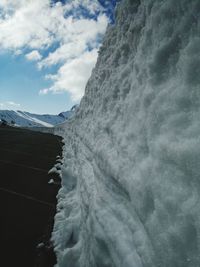 Scenic view of waterfall against sky