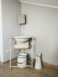 Empty chairs and table against wall at home