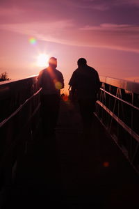 Silhouette of woman at sunset