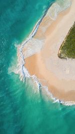 High angle view of surf on shore