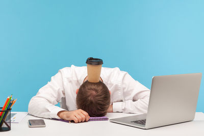 Man using laptop on table