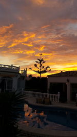 Built structure against sky at sunset