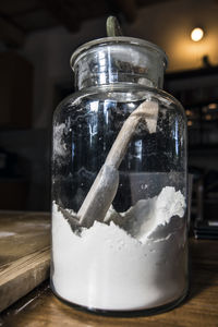 Close-up of drink in glass jar on table