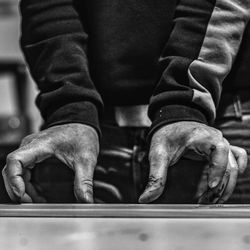 Midsection of man working in workshop