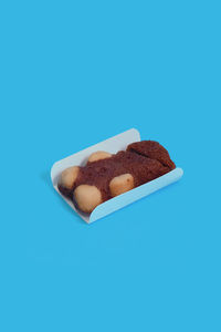 High angle view of dessert against blue background