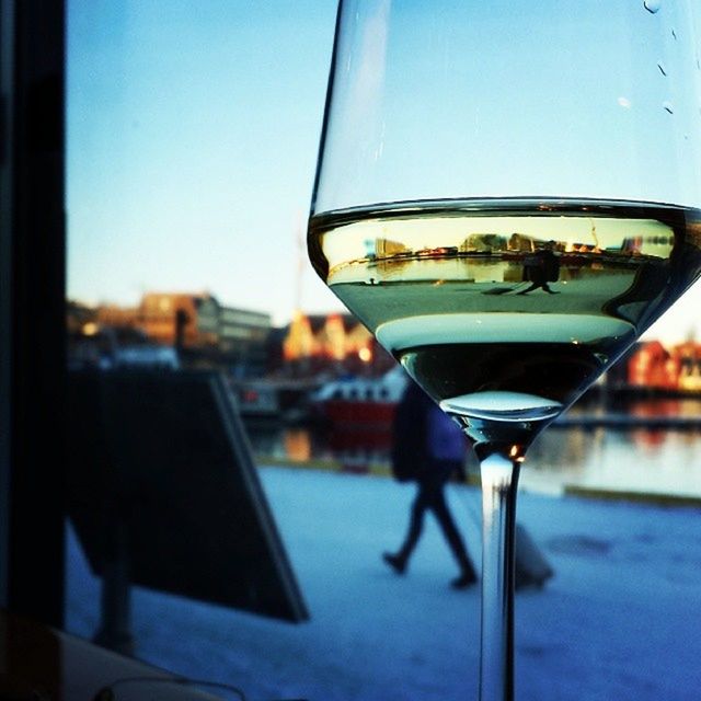 table, drink, food and drink, glass - material, focus on foreground, refreshment, transparent, drinking glass, indoors, close-up, window, glass, restaurant, sky, alcohol, blue, day, wineglass, still life, clear sky