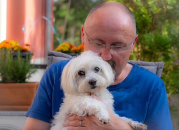 Portrait of man with dog