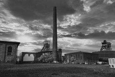 Low angle view of factory against sky