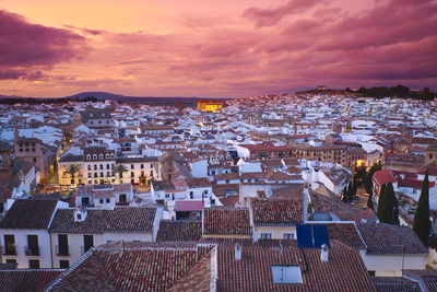 High angle shot of townscape against sky at sunset