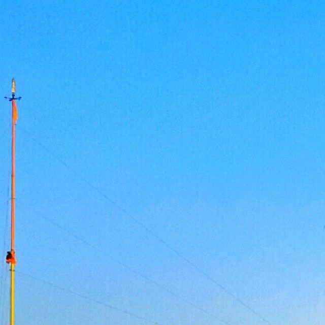 clear sky, copy space, blue, low angle view, street light, lighting equipment, built structure, connection, electricity, power line, architecture, pole, outdoors, technology, communication, high section, cable, no people, day, guidance