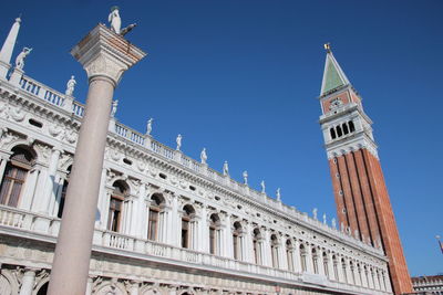 Low angle view of san marco campanile at piazza san marco against clear sky
