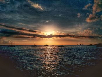 Scenic view of sea against dramatic sky