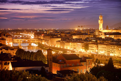 High angle view of illuminated buildings in city