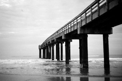 View of pier over sea against sky