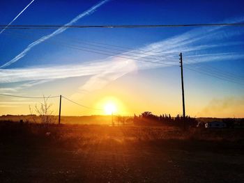 Scenic view of landscape against sky at sunset