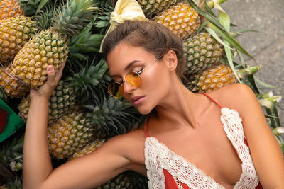 Midsection of woman holding pineapple
