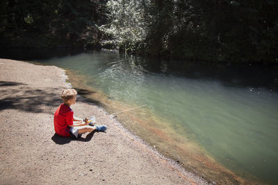 Boy fishing in river