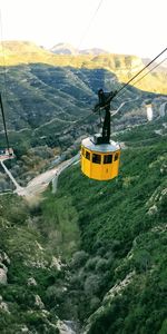 High angle view of overhead cable car against mountains