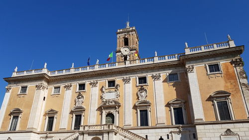 Low angle view of building against blue sky