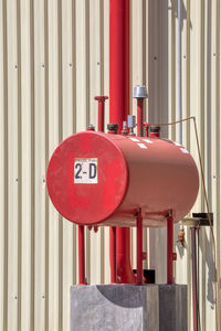 Close-up of red pipe against wall