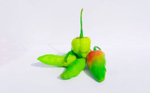 Close-up of bell peppers against white background