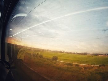 Scenic view of field against sky during sunset