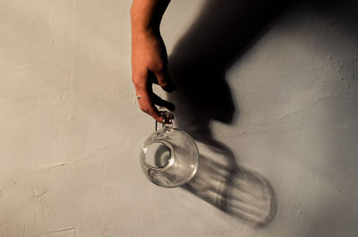 High angle view of man hanging on wall