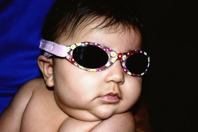 Close-up portrait of girl wearing sunglasses