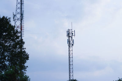 Low angle view of communications tower against sky