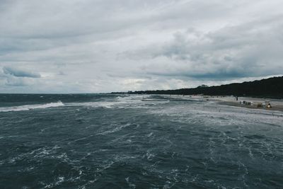 Scenic view of sea against cloudy sky