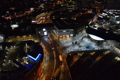 High angle view of illuminated street and city at night