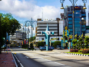 City street and modern buildings against sky