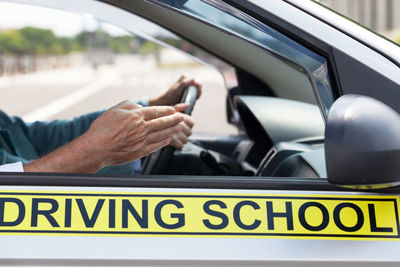 Close-up of hand on car