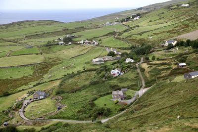 High angle view of green irish  landscape against sky