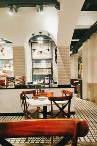 Empty chairs and tables in cafe