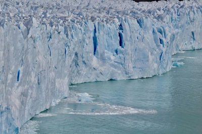 Scenic view of glacier against sky