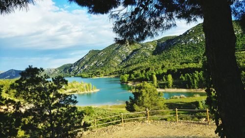 Scenic view of lake against cloudy sky