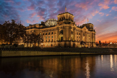 Low angle view of reichstag building against sky at dusk