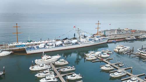 Commercial marina for yachts with decommissioned warships moored