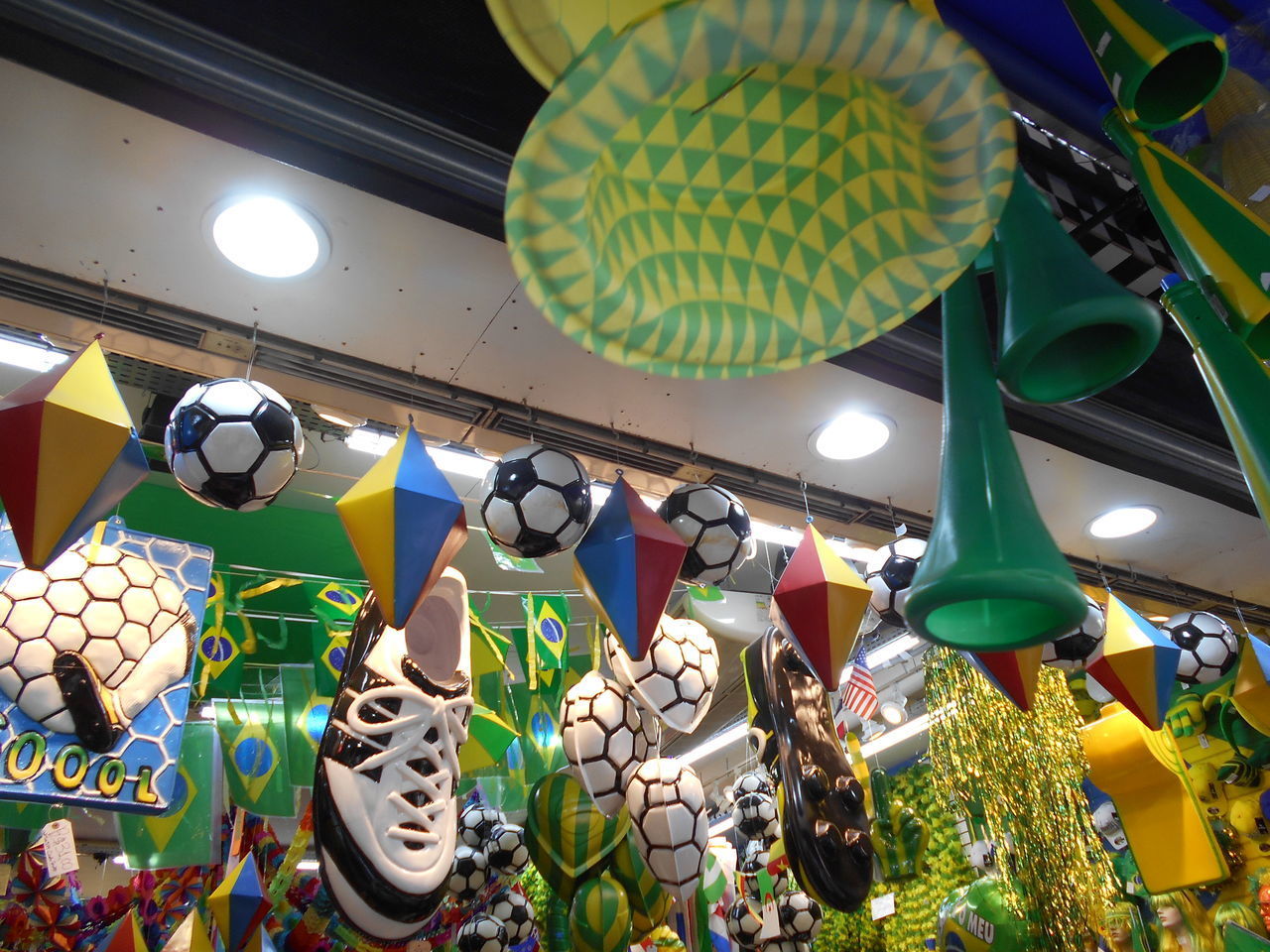 LOW ANGLE VIEW OF ILLUMINATED LANTERNS HANGING IN CEILING