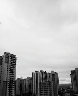 Modern buildings in city against sky