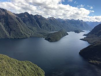 Scenic view of lake and mountains against sky