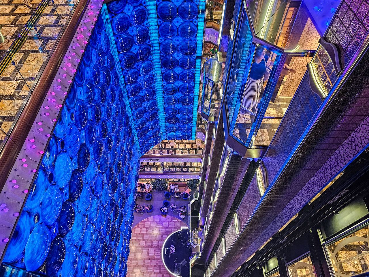 architecture, built structure, blue, building exterior, low angle view, no people, metropolis, night, illuminated, urban area, multi colored, city, building, cityscape, travel destinations, pattern, outdoors, skyscraper