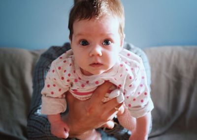 Close-up portrait of cute boy at home