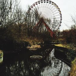 Reflection of trees in lake against sky
