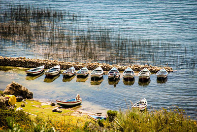 High angle view of boats moored at lake