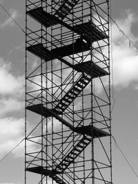 Low angle view of crane against sky