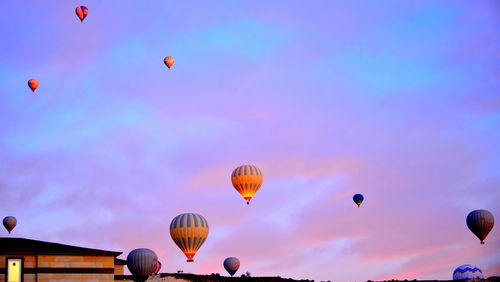 Hot air balloons flying against sky