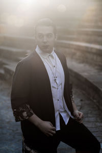 Portrait of young man standing outdoors