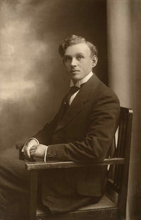 Full length of man sitting on chair